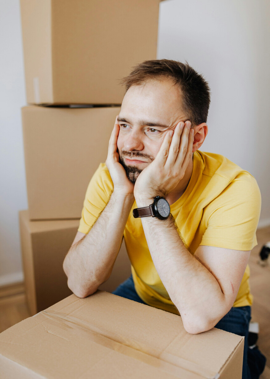 Man with hands on his face looking stressed