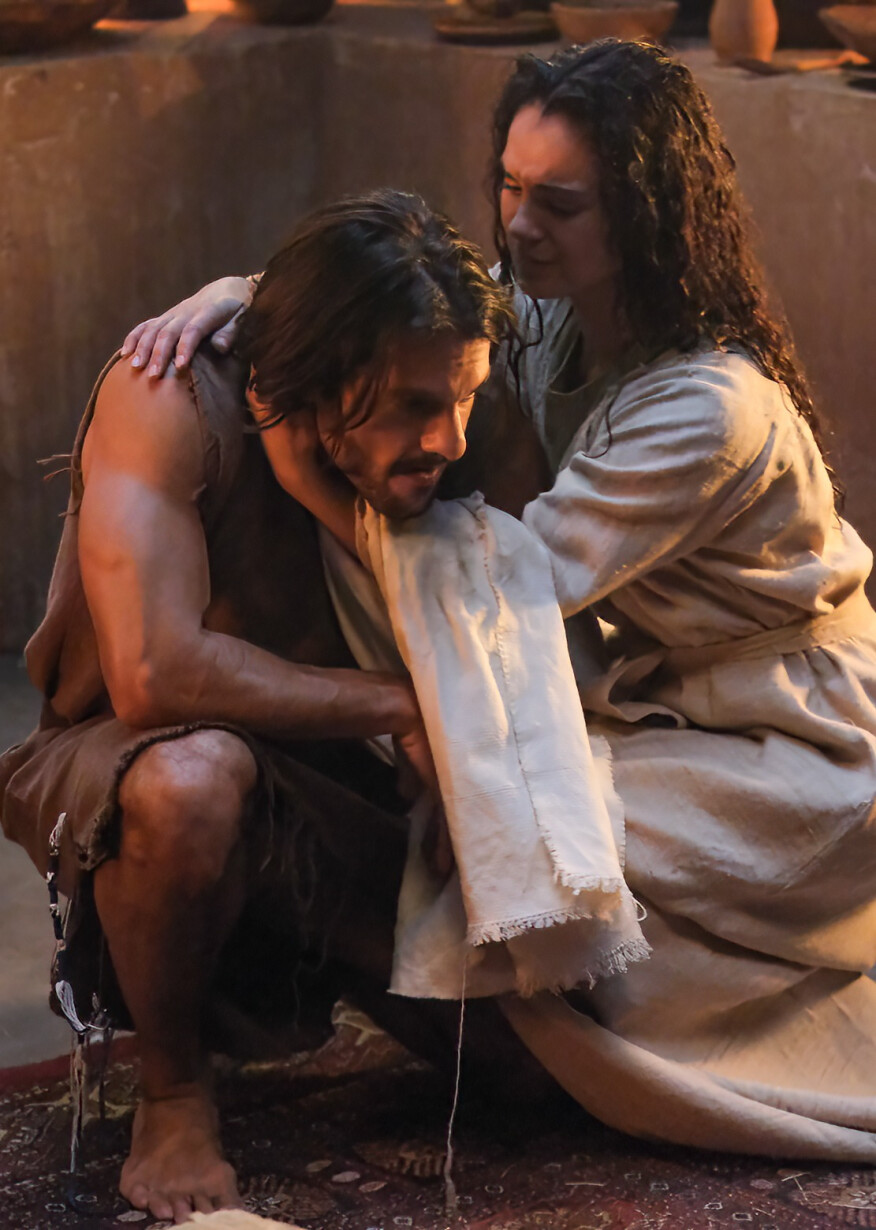 A despairing Simon Peter being comforted by his wife Eden