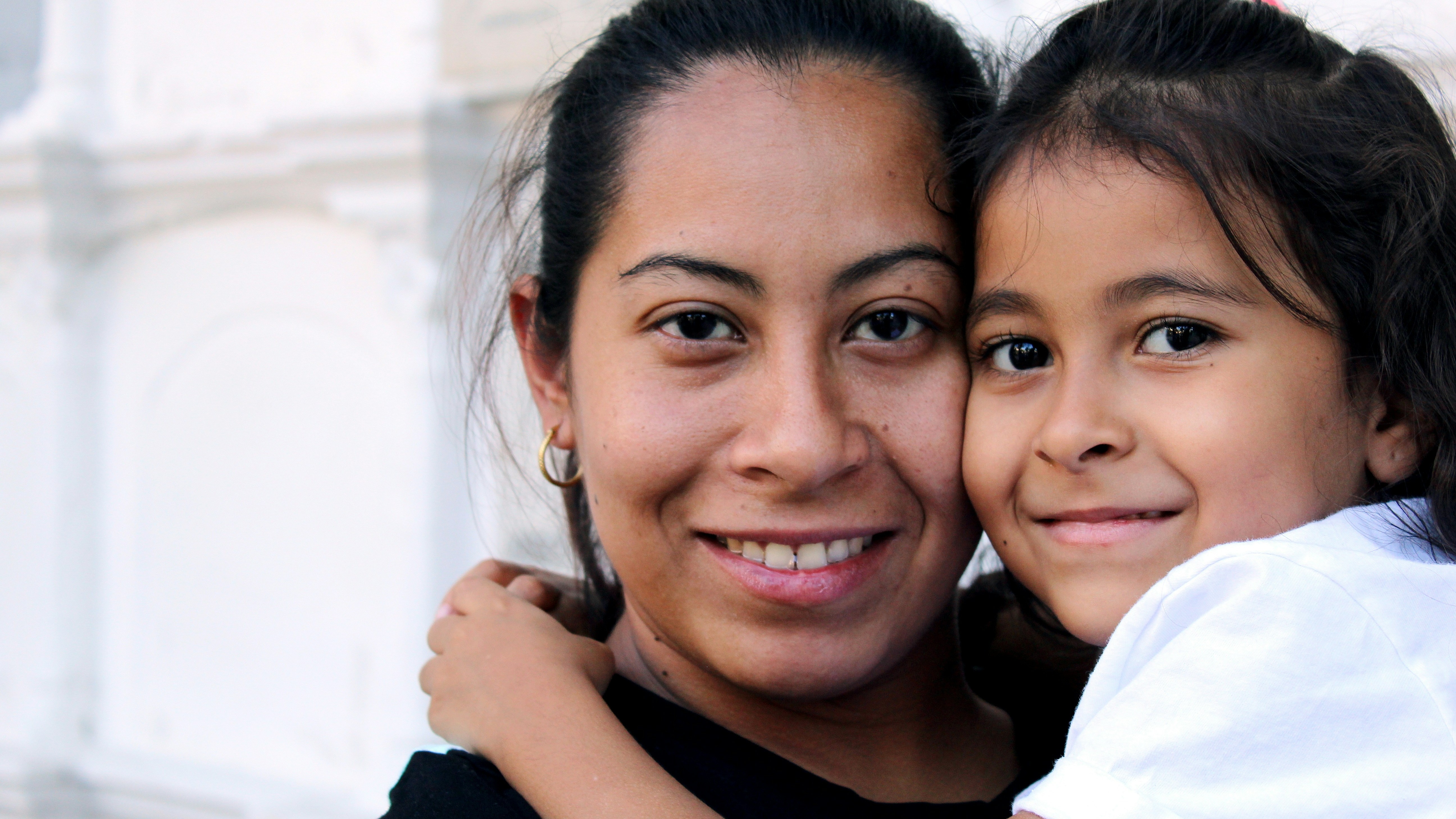 A mother holding her daughter