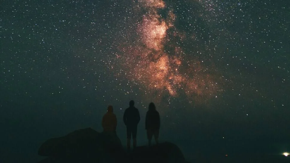 people in front of night sky